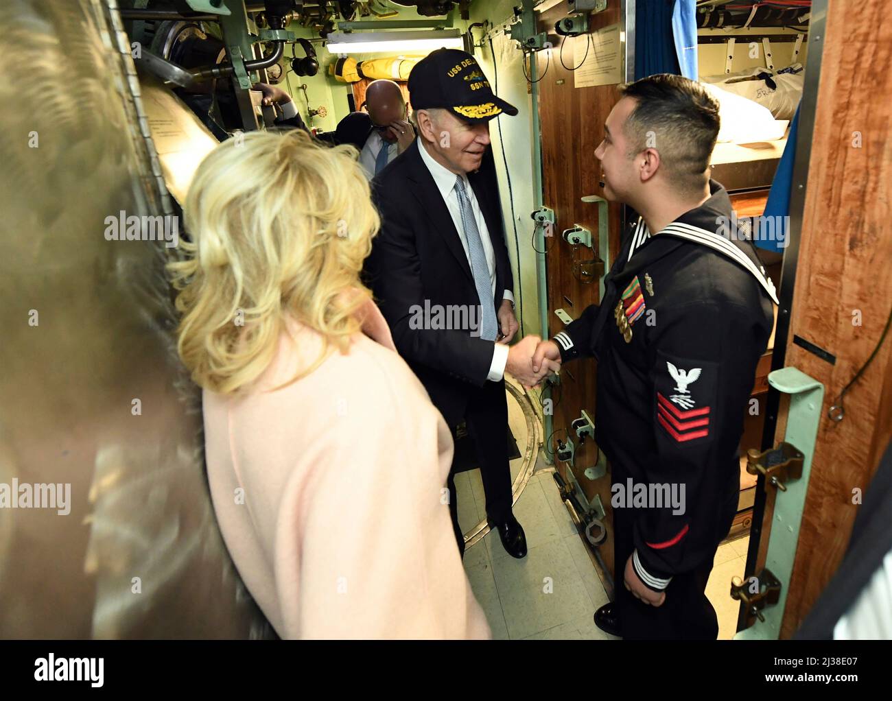 Wilmington, United States of America. 02 April, 2022. U.S President Joe Biden, center, and First Lady Jill Biden, left, greet PO1 David Jaimeruiz during a tour of the Virginia-class attack submarine USS Delaware following the commissioning ceremony, April 2, 2022 in Wilmington, Delaware.  Credit: CPO Joshua Karsten/White House Photo/Alamy Live News Stock Photo