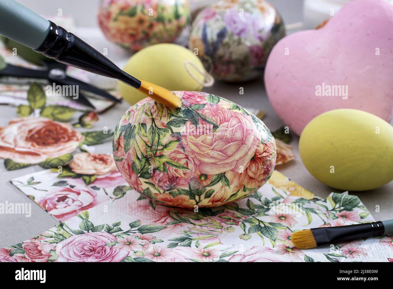 Decorating Easter eggs with decoupage technique. Hobby time Stock Photo