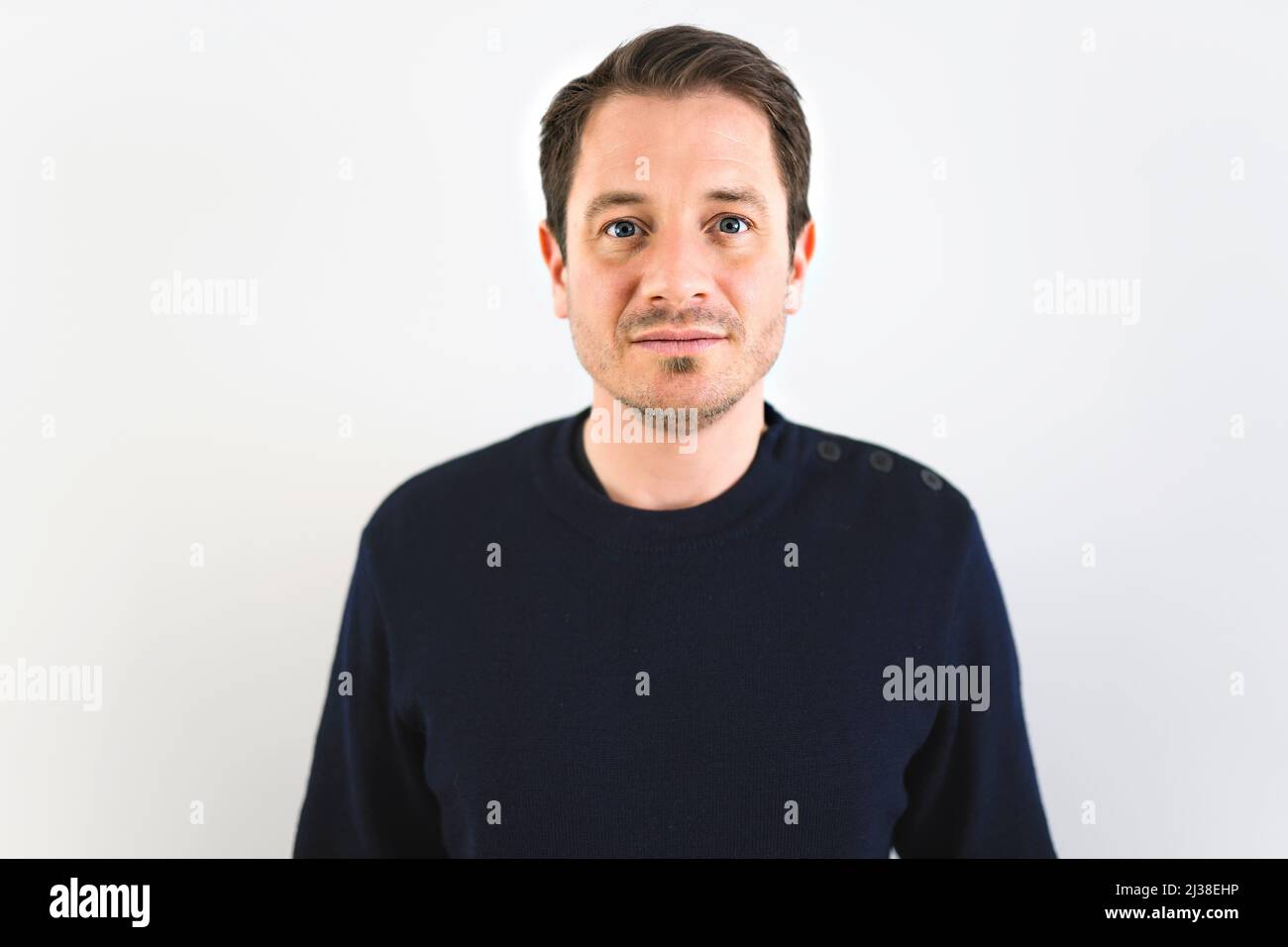 European man on studio white background portrait Stock Photo