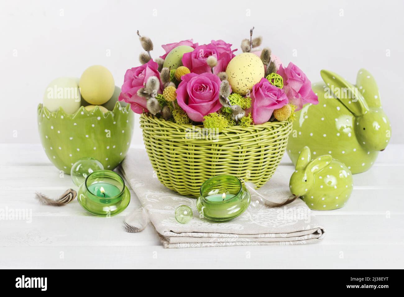 Easter table decoration with roses, moss and catkins. Festive time Stock Photo