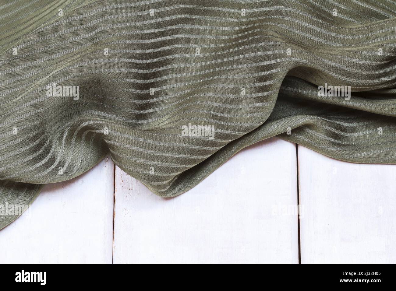 A soft olive green fabric background. Graphic resources Stock Photo