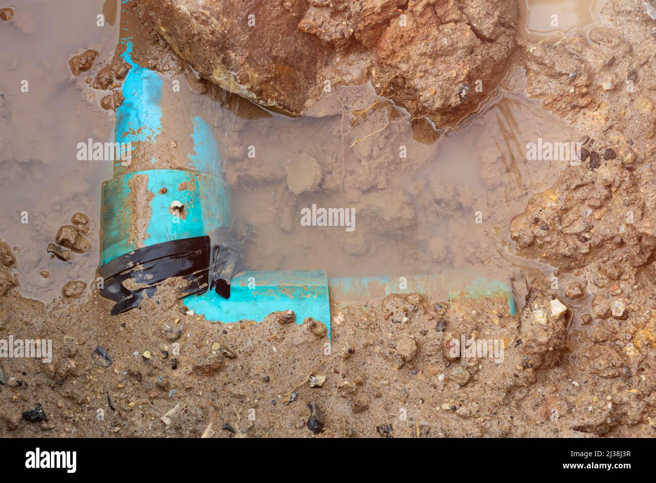 plumbing broken plastic pipe in the hole and water in wait repair Stock ...