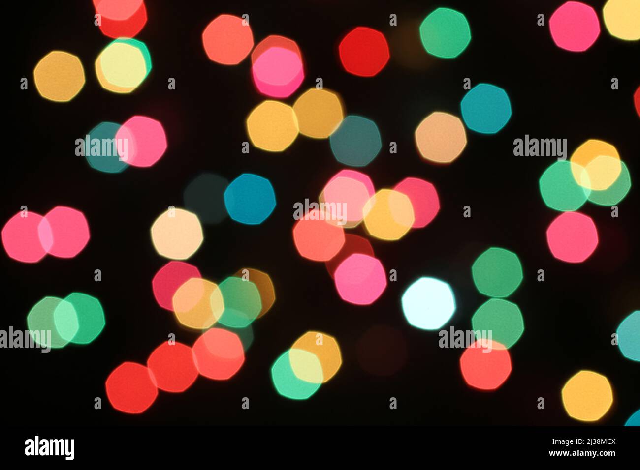 Defocused colorful lights on black background Stock Photo