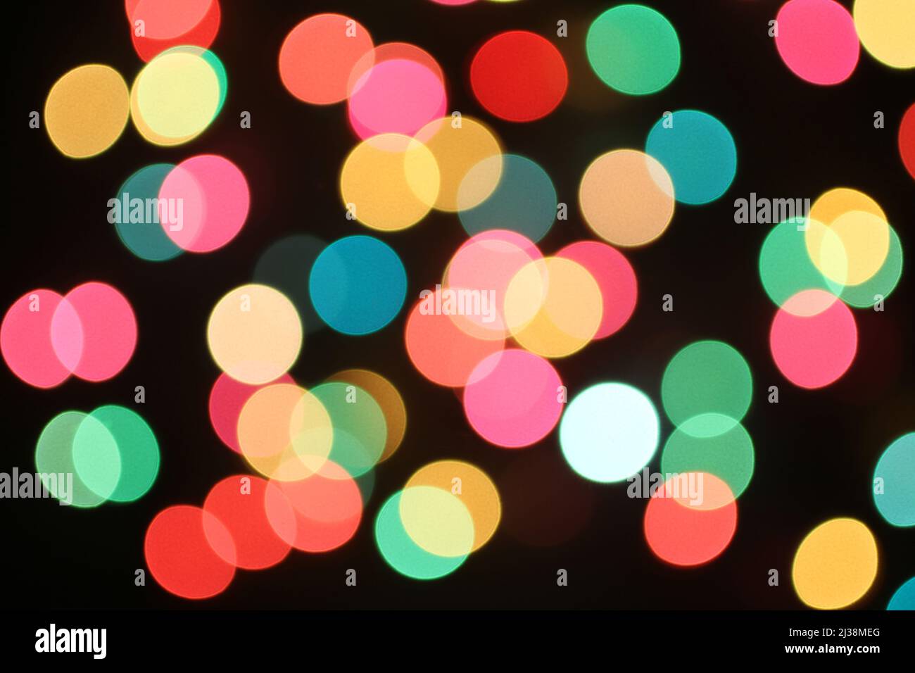 Defocused colorful lights on black background Stock Photo