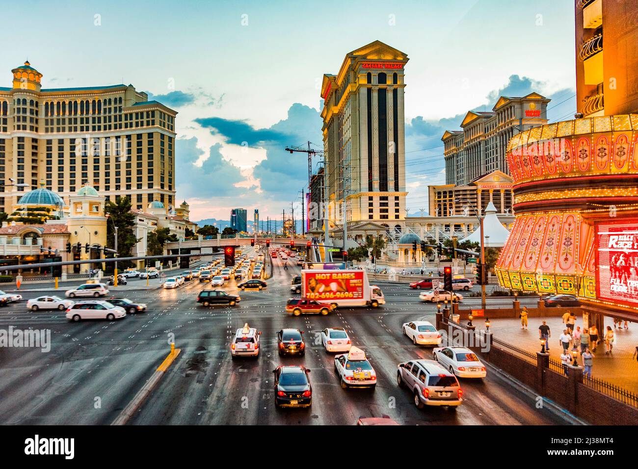 Las Vegas, USA - July 17, 2008: View to the Strip in Las Vegas in the  evening with cars on the street and neon lights in the Bars, Hotels and  Gambling Stock Photo - Alamy