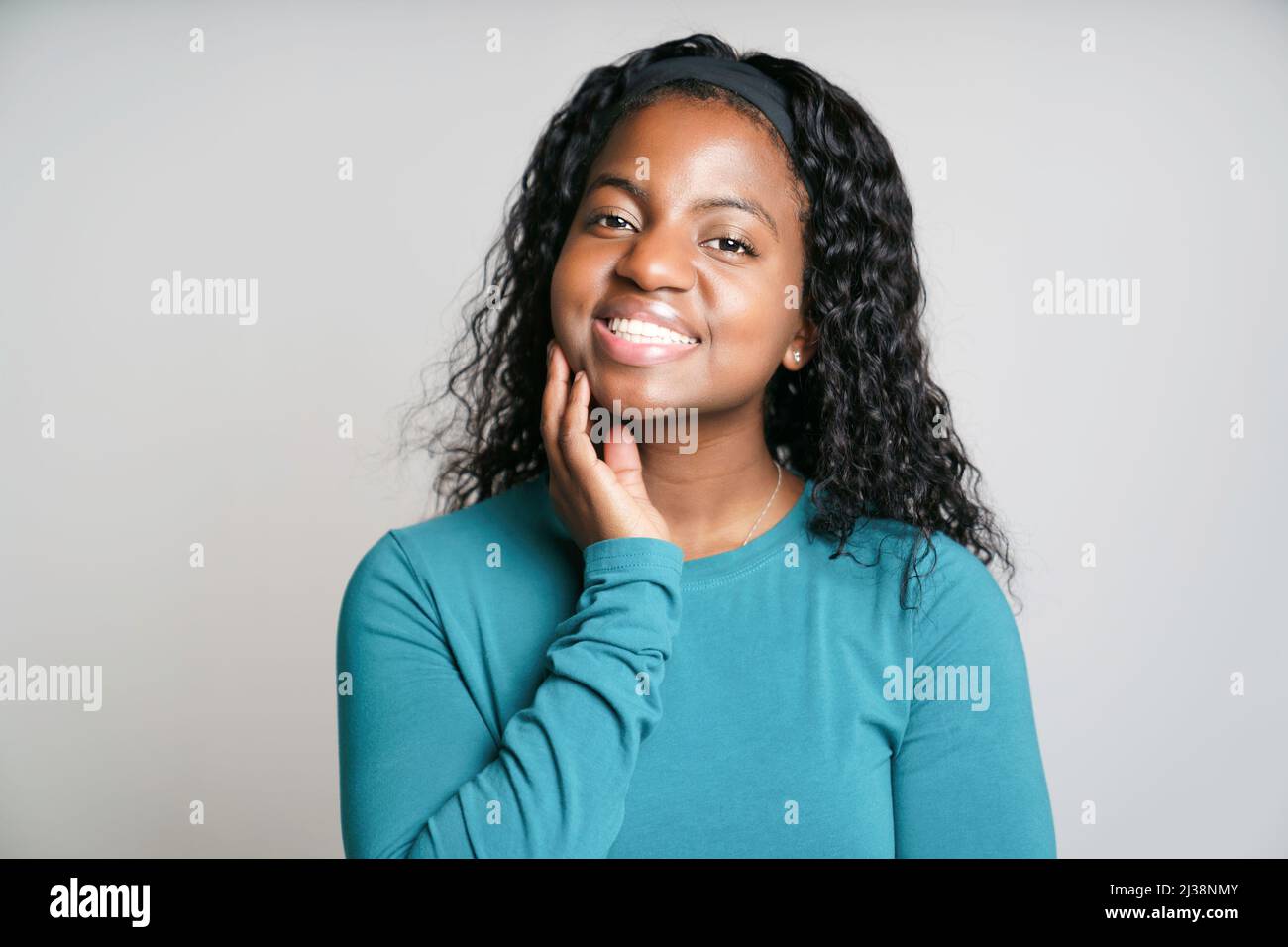 Young African Woman smiling on White Background Stock Photo - Alamy