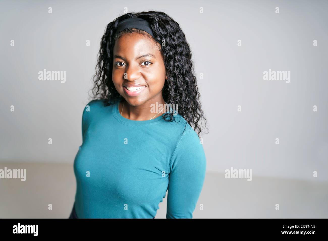 Young African Woman smiling on White Background Stock Photo - Alamy