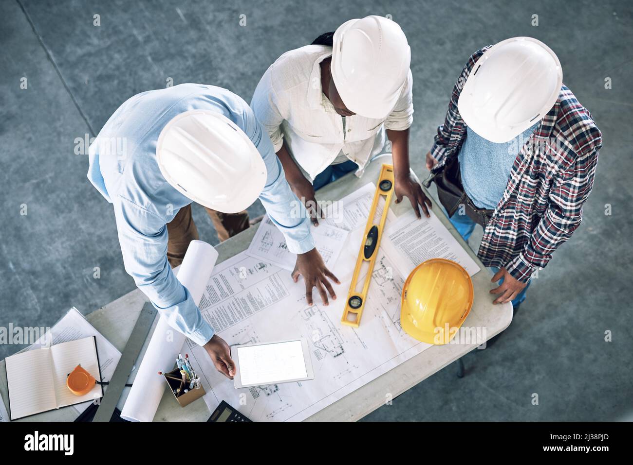 Taking clients designs to the next level. Shot of a group of builders