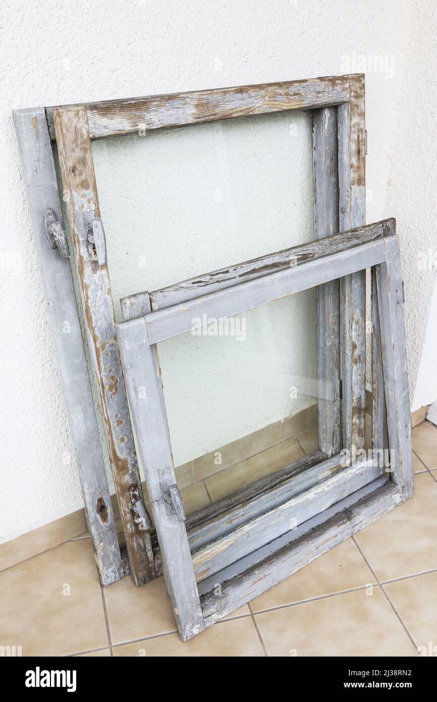 Old wooden window frames taken out of the building for renovation