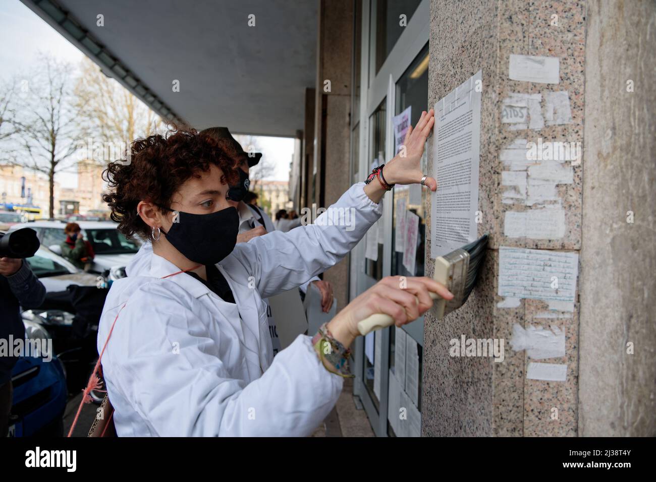 Turin, Italy. 6th April, 2022. Extinction Rebellion activists glue the 6th IPCC report on the Piedmont Region Office doors as part of the Scientist Rebellion mobilization on all continents with over 1000 scientists and academics involved. Credit: MLBARIONA/Alamy Live News Stock Photo