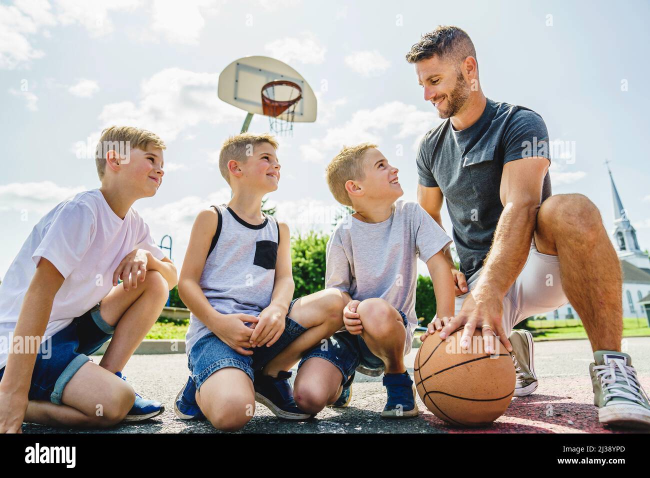 Happy basketball family portrait play this sport on summer season. The