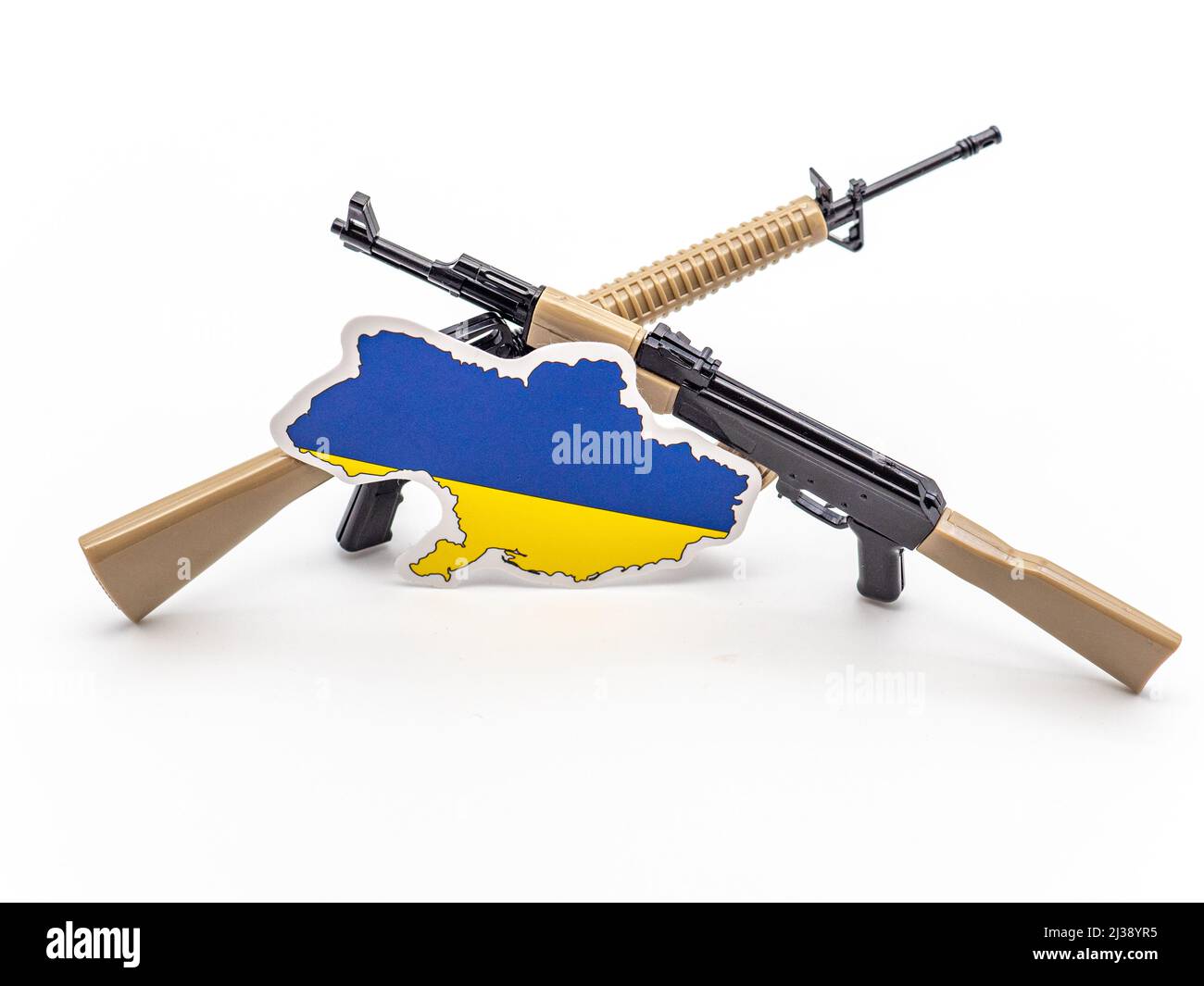 An Ukraine map and two guns in the background concept of war Stock Photo