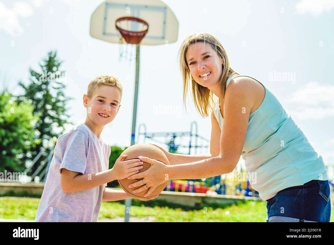 Happy basketball family portrait play this sport on summer season. The
