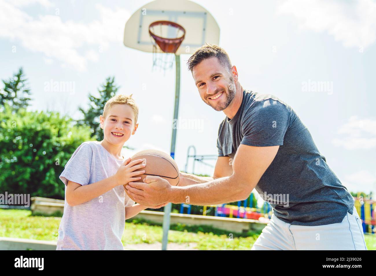 Happy basketball family portrait play this sport on summer season. The