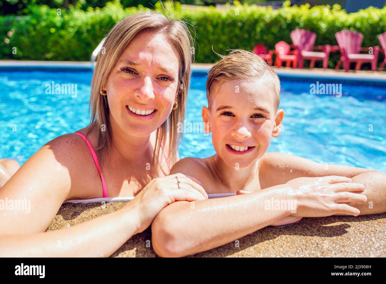 mother and son having fun in swimming pool Stock Photo Alamy
