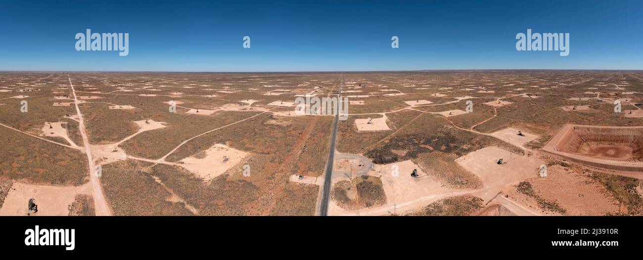 Loco Hills, New Mexico - A panorama showing oil wells that cover the landscape in the Permian Basin. The Permian Basin is a major oil and gas producin Stock Photo