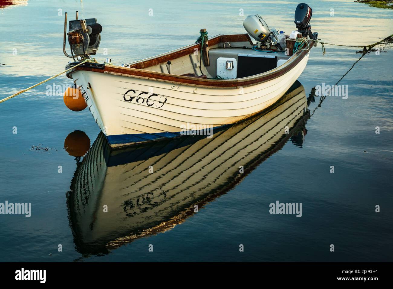 Wooden dinghy with outboard motors in Roundstone harbour, Connemara
