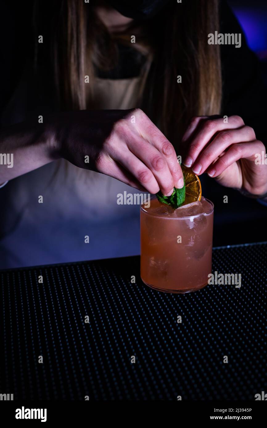 Hand grabbing cocktail glass bar hi-res stock photography and images ...