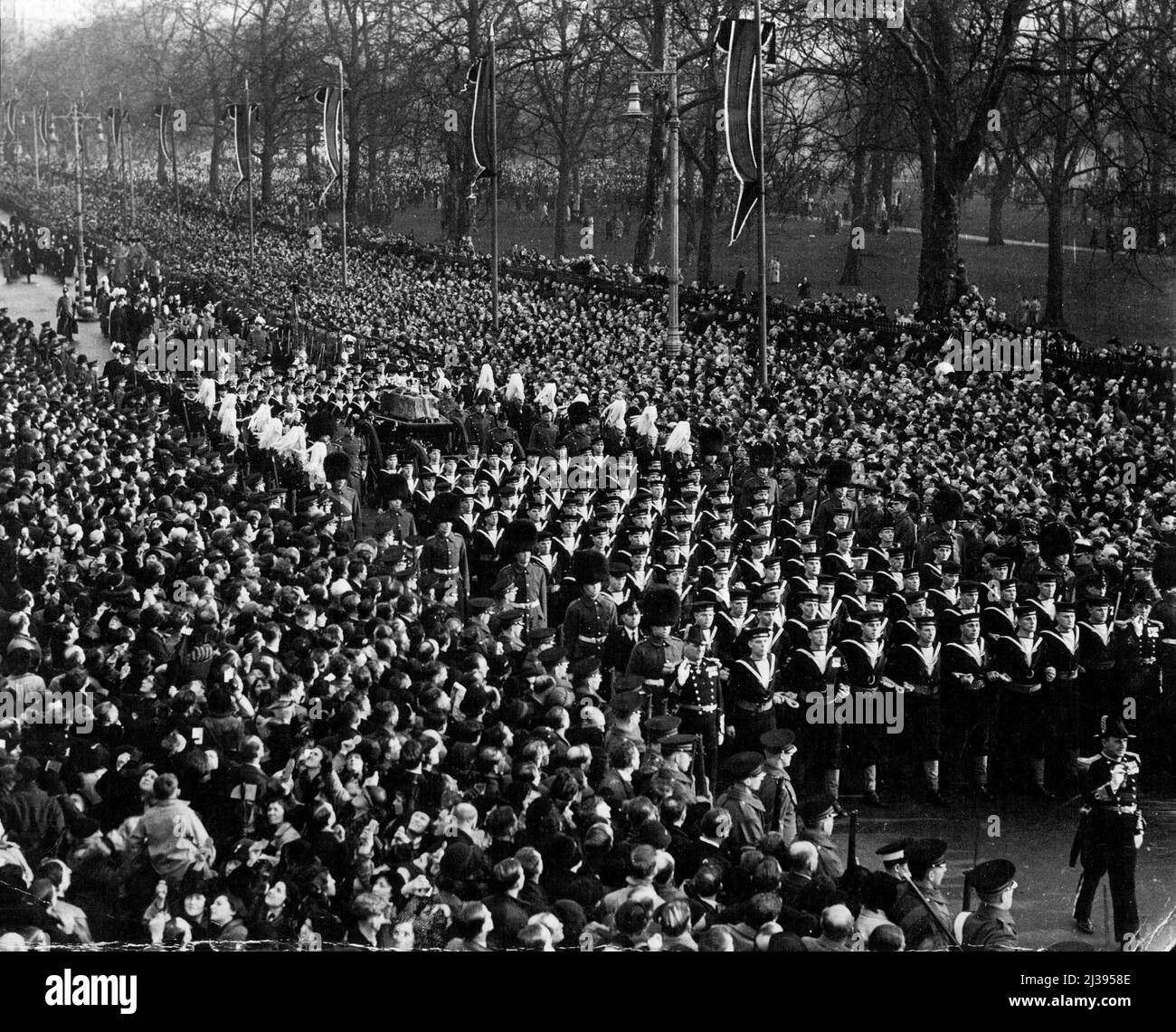 Funeral of the Late King George V. A general view of the Royal funeral procession passing along Piccadilly, London, W., en route from Westminster Hall ***** Paddington Station. January 1, 1936. (Photo by Topical press). Stock Photo