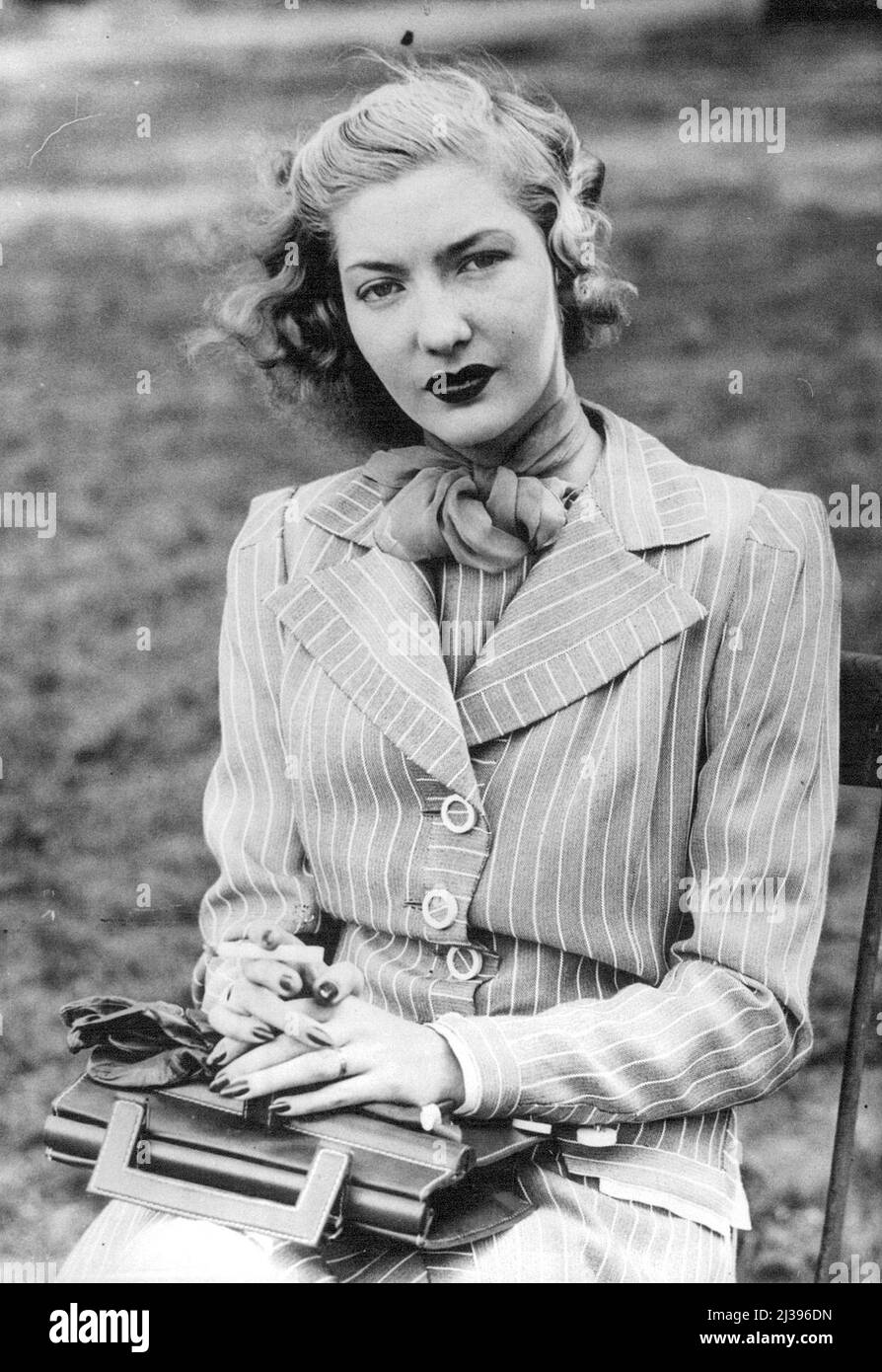 Girl Who Is 'Direct Successor To Great Garbo' Is Visiting London -- Corinne Luchaire photographed in ***** Park, London, while enjoying a quiet smoke. Described by Mary Pickford as 'the direct successor to Greta Garbo', Corinne Luchaire, beautiful blonde French film actress of 17 years, is making a secret stay in London with her father, mother and brother. Every producer in London and Hollywood who has ***** her has tried to sign a contract with Corinne ***** to her success in the French film 'Prison without Bars'. May 23, 1938. Stock Photo