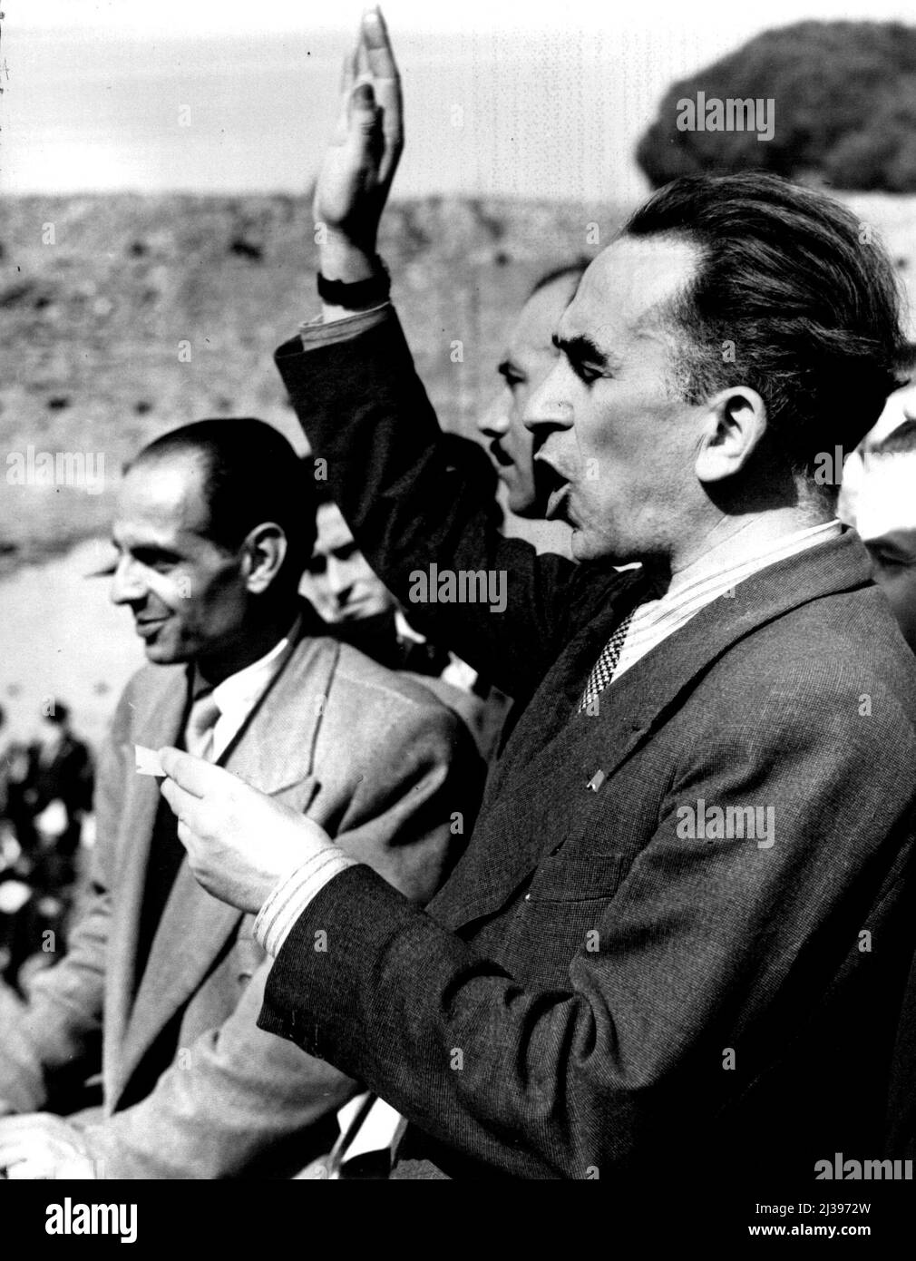 Italian Leaders Asks For Elections. Luigo Longo, (standing on Rostrum), communist leader and former partisan commander in North Italy, addresses 20,000 in the stadium of Domitian on Palatine hill, Rome, Italy, Oct. 14. He asked for immediate elections in Italy to foster democracy and start the nation on the reconstruction road. October 21, 1945. (Photo by Associated Press Photo) Stock Photo