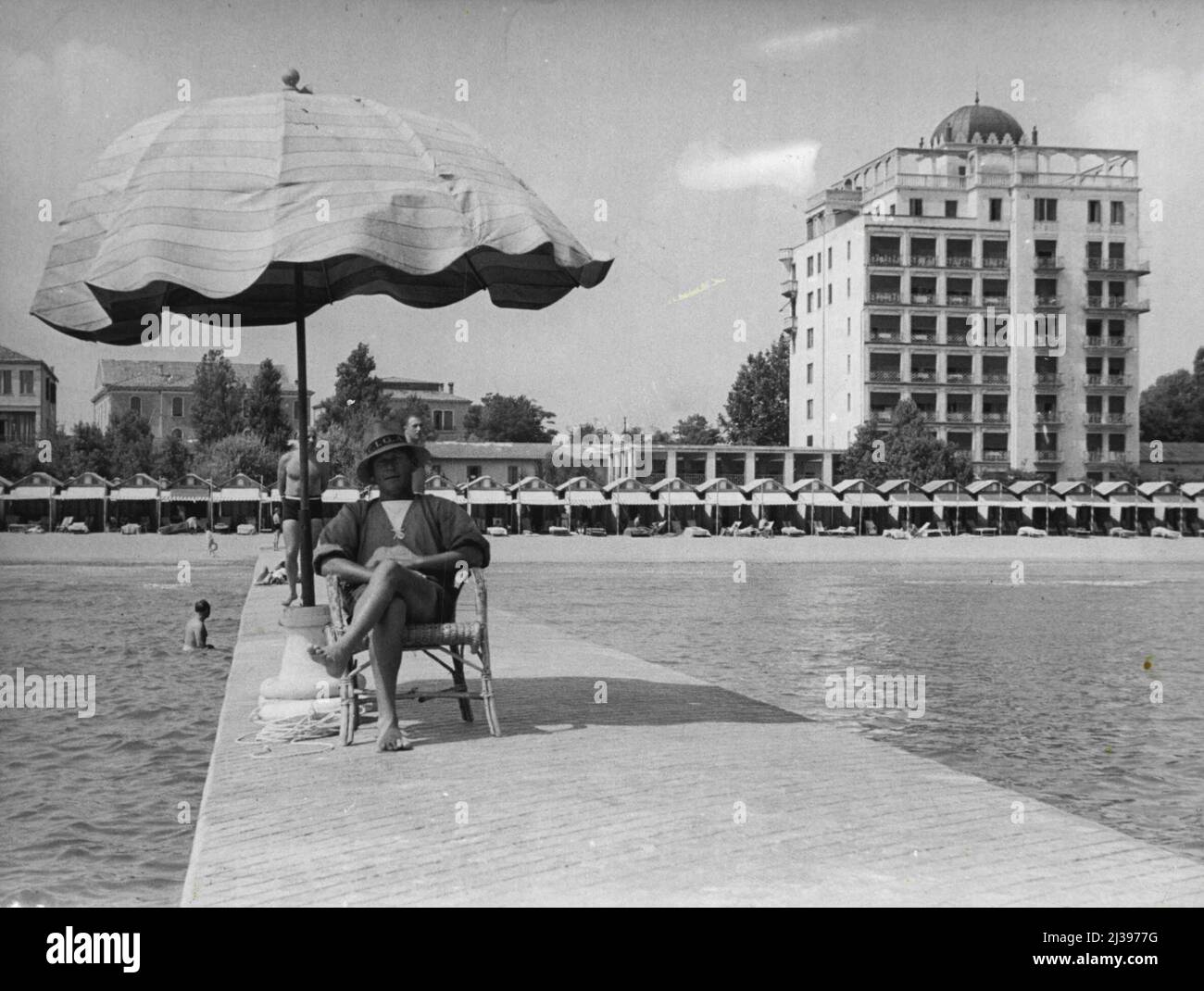 The Lido lifesaver, with the Excelsior Hotel in the background. October 22, 1951. Stock Photo