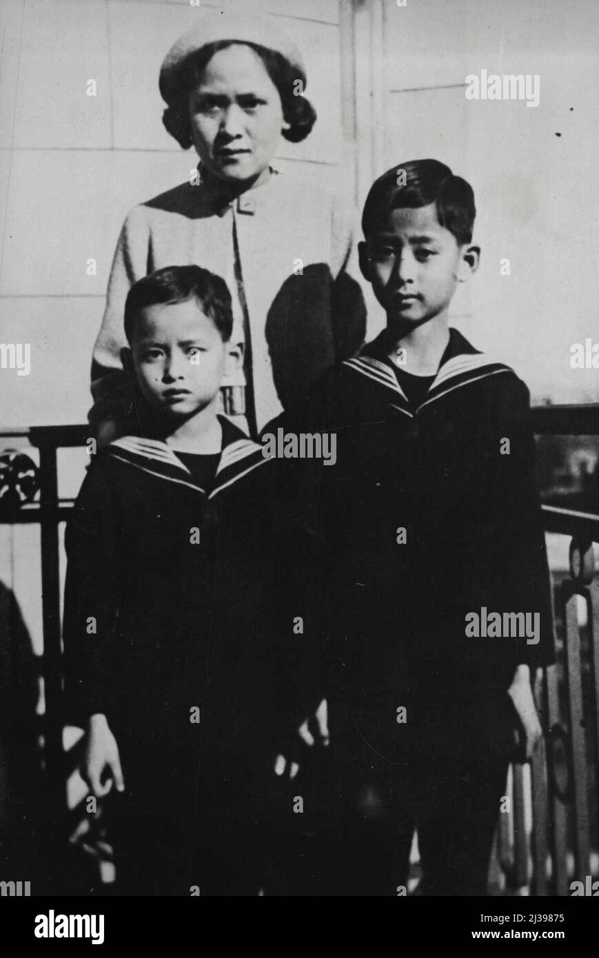 Boy King of Siam Receives First official Delegation His Majesty Anada, King of Siam, who is to remain at school at Lausanne for the next two years, received his first official delegation, from Swiss Government, at the Lausanne ***** Hotel recently. King Ananda (right) with his you ***** brother and his mother, Princess Mahidol, after the ceremony. May 13, 1935. (Photo by Associated Press Photo). Stock Photo