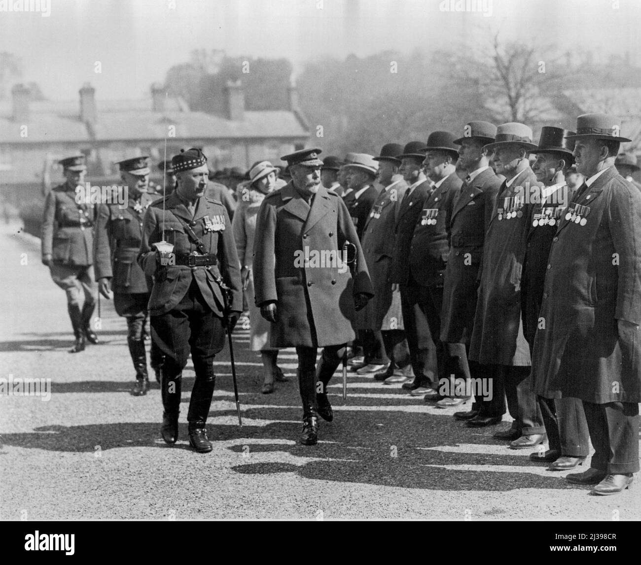 The King inspecting past members of the 1st Royal Scots, the oldest regiment in the British