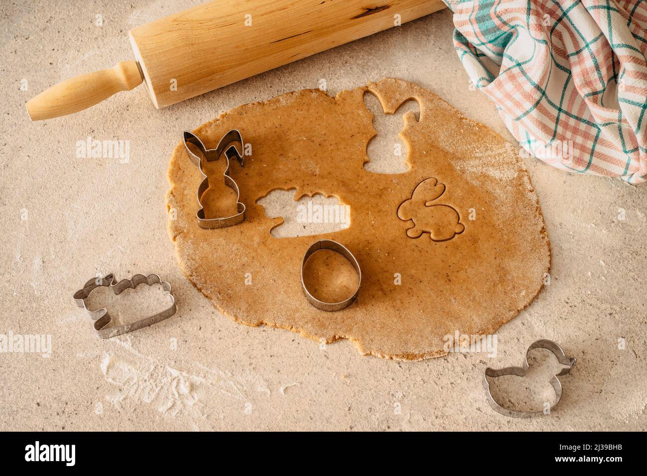 Easter baking flat lay.Spring symbols made from gingerbread.Homemade cookies.Easter bunny,rabbit,eggs and ducks from delicious honey dough. Stock Photo