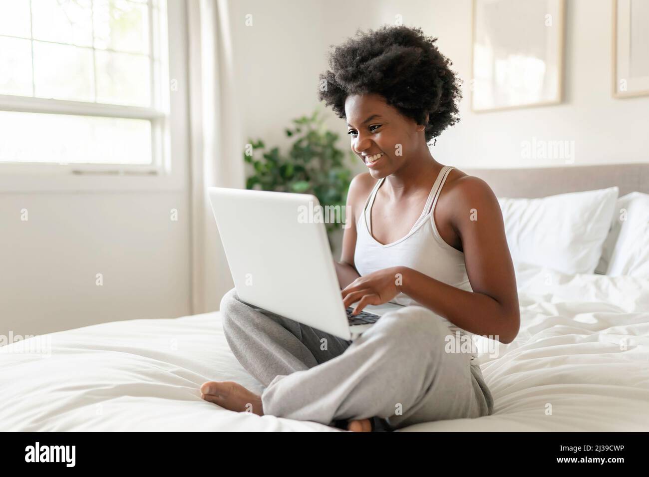 Women in Sporty Pajamas Sit or Chat Online with Friends or Shopping Online.  Stock Photo - Image of computer, female: 145925022