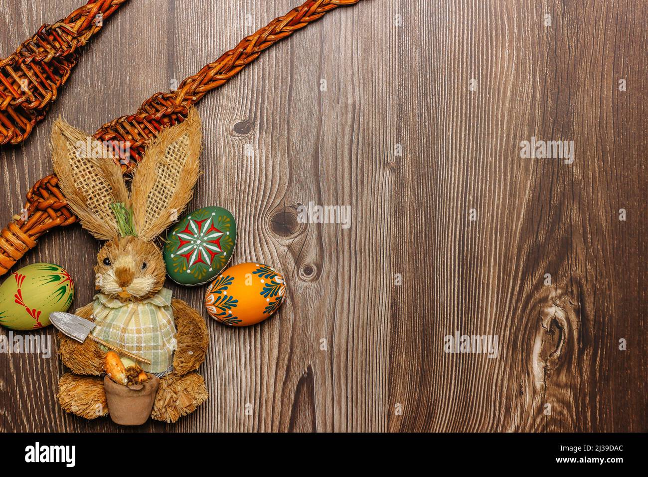 Colorful Easter Eggs,bunny,willow branches banner.Above view with copy space.Happy Easter decoration background,colorful hand painted decorated eggs.S Stock Photo