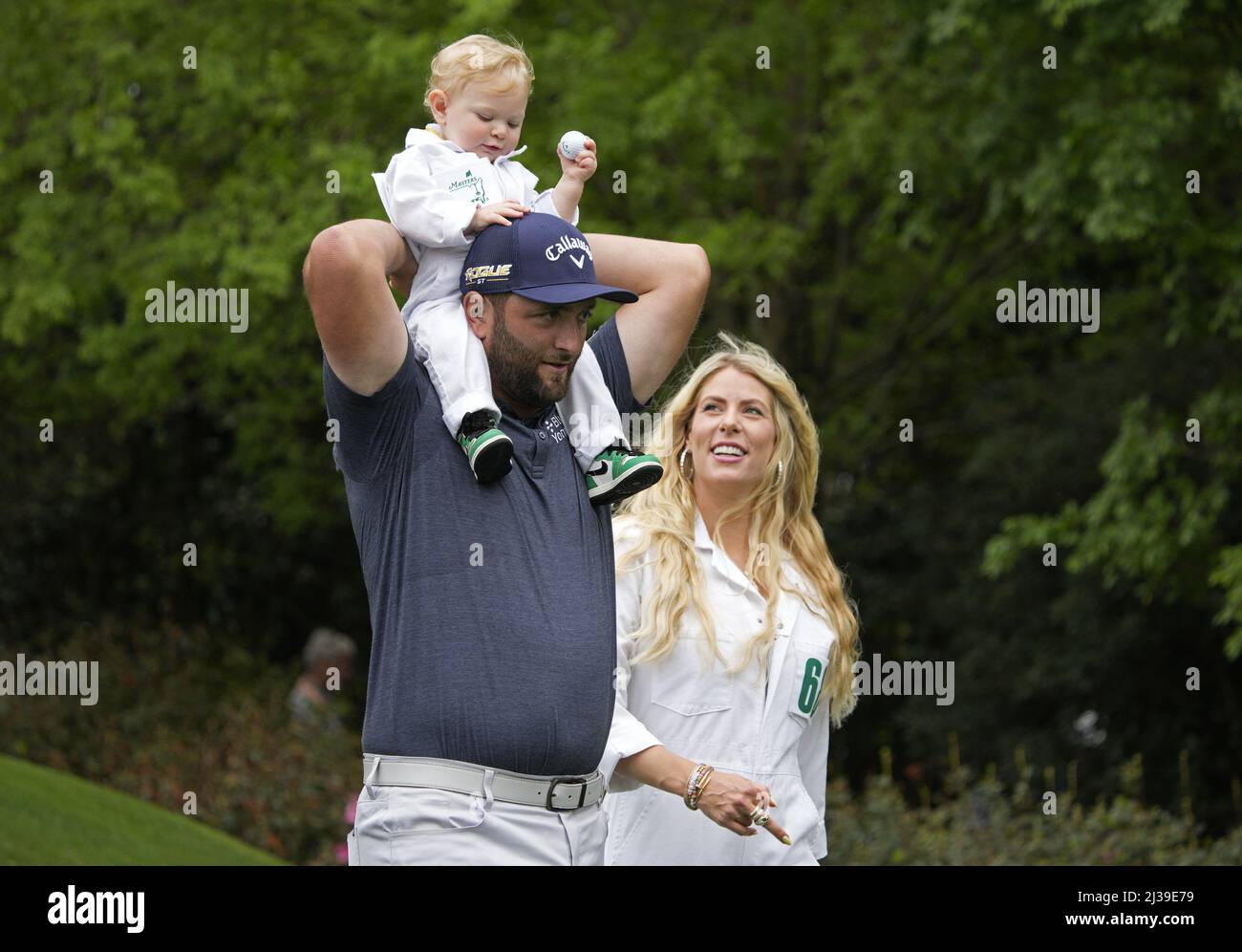 Augusta, United States. 06th Apr, 2022. Jon Rahm of Spain holds his son Kepa as he and his wife Kelley compete in the Par 3 Contest at the Masters golf tournament at Augusta National Golf Club in Augusta, Georgia on Wednesday, April 6, 2022. Photo by Bob Strong/UPI Credit: UPI/Alamy Live News Stock Photo