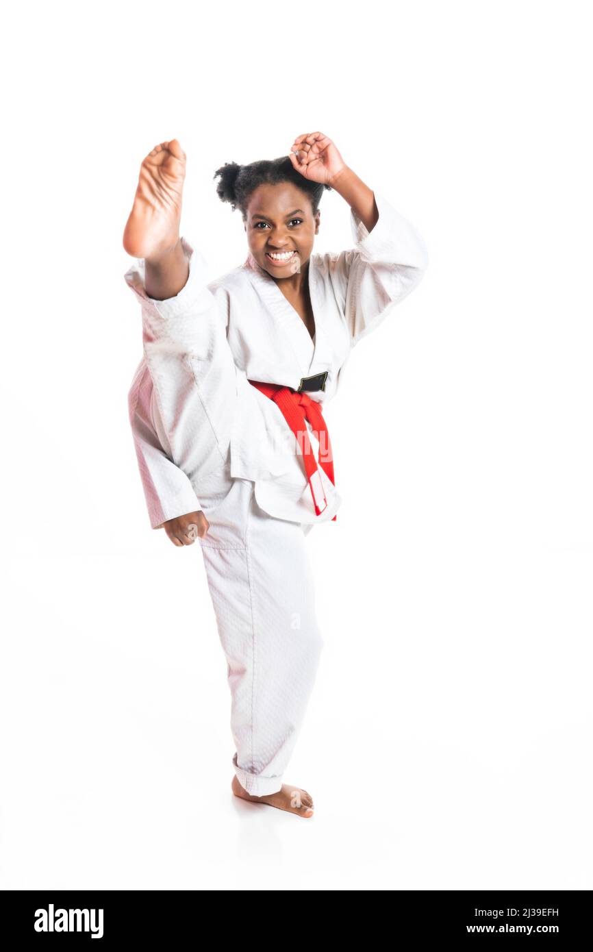 Young black belt karate fighter training Isolated portrait on white background Stock Photo