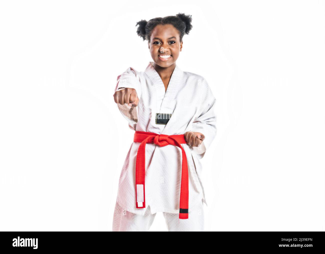 Young black belt karate fighter training Isolated portrait on white background Stock Photo