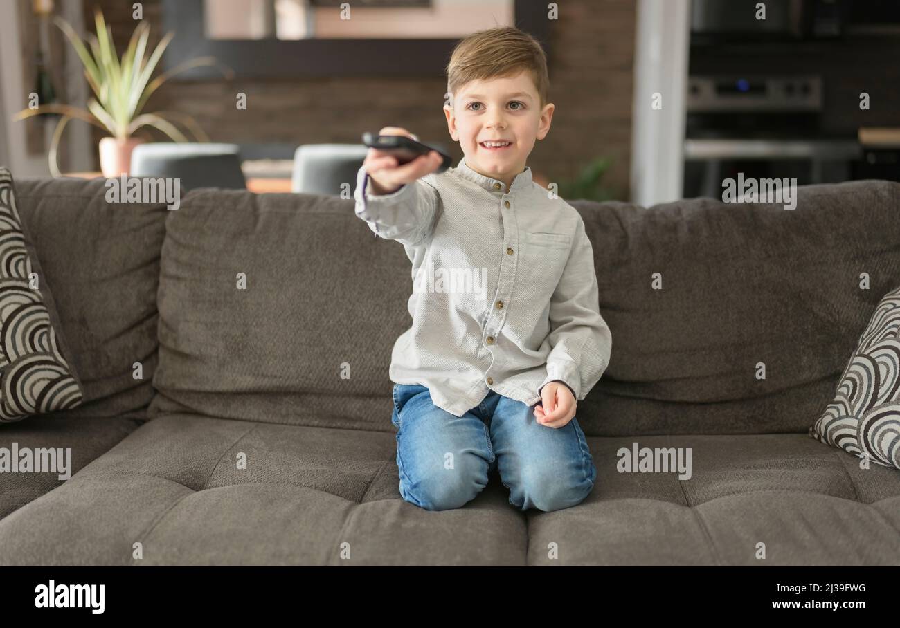 boy watching television sit on the sofa at home Stock Photo Alamy