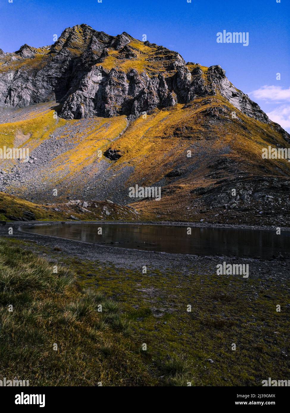 A beautiful view of a lake and a mountain under the blue sky Stock ...