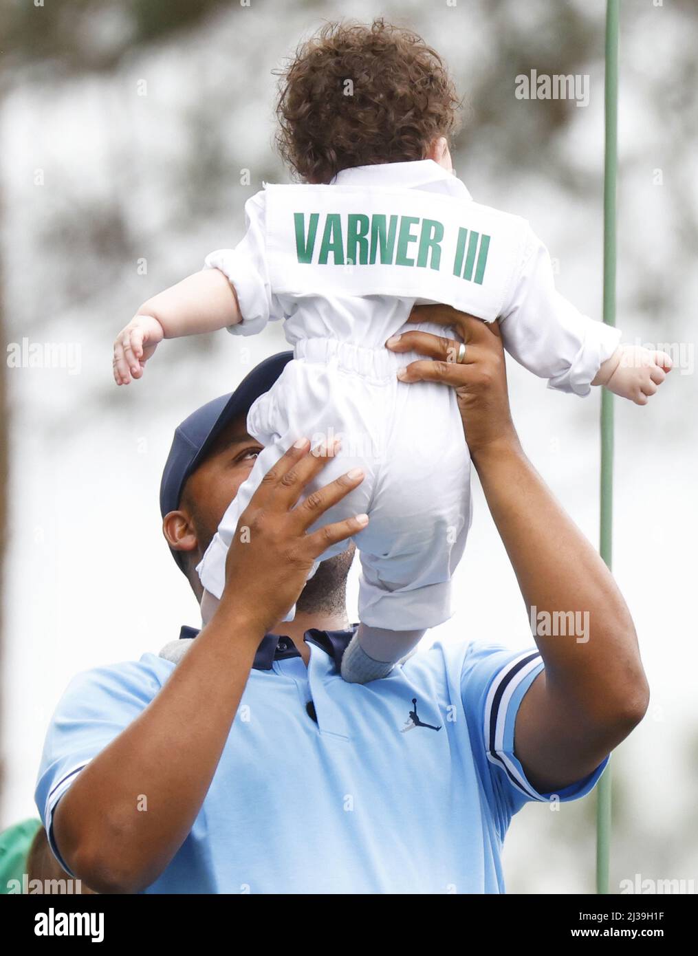 Augusta, United States. 06th Apr, 2022. Harold Varner III holds son