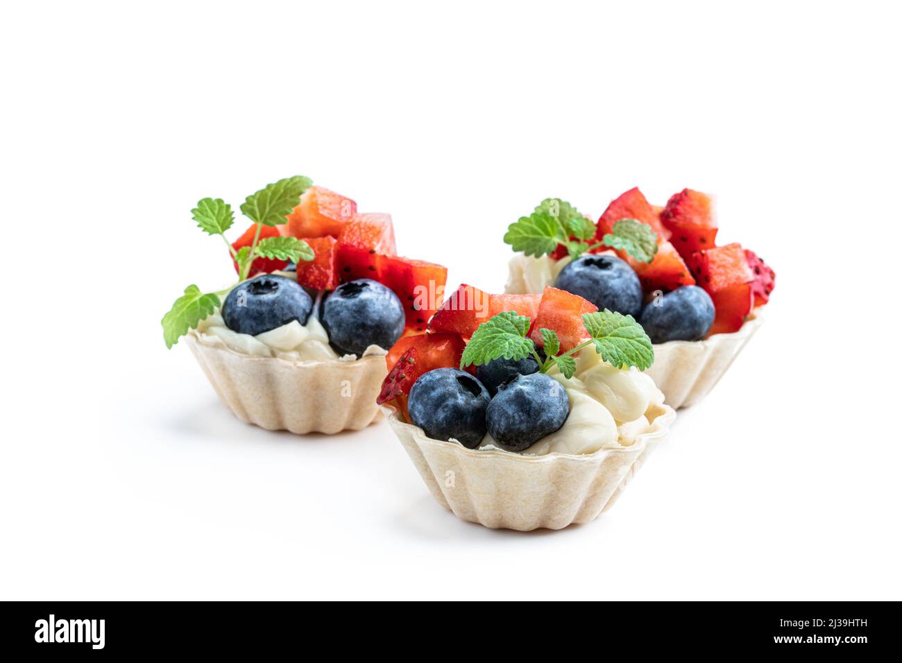 Fresh  berry tartlets dessert isolated on white Stock Photo