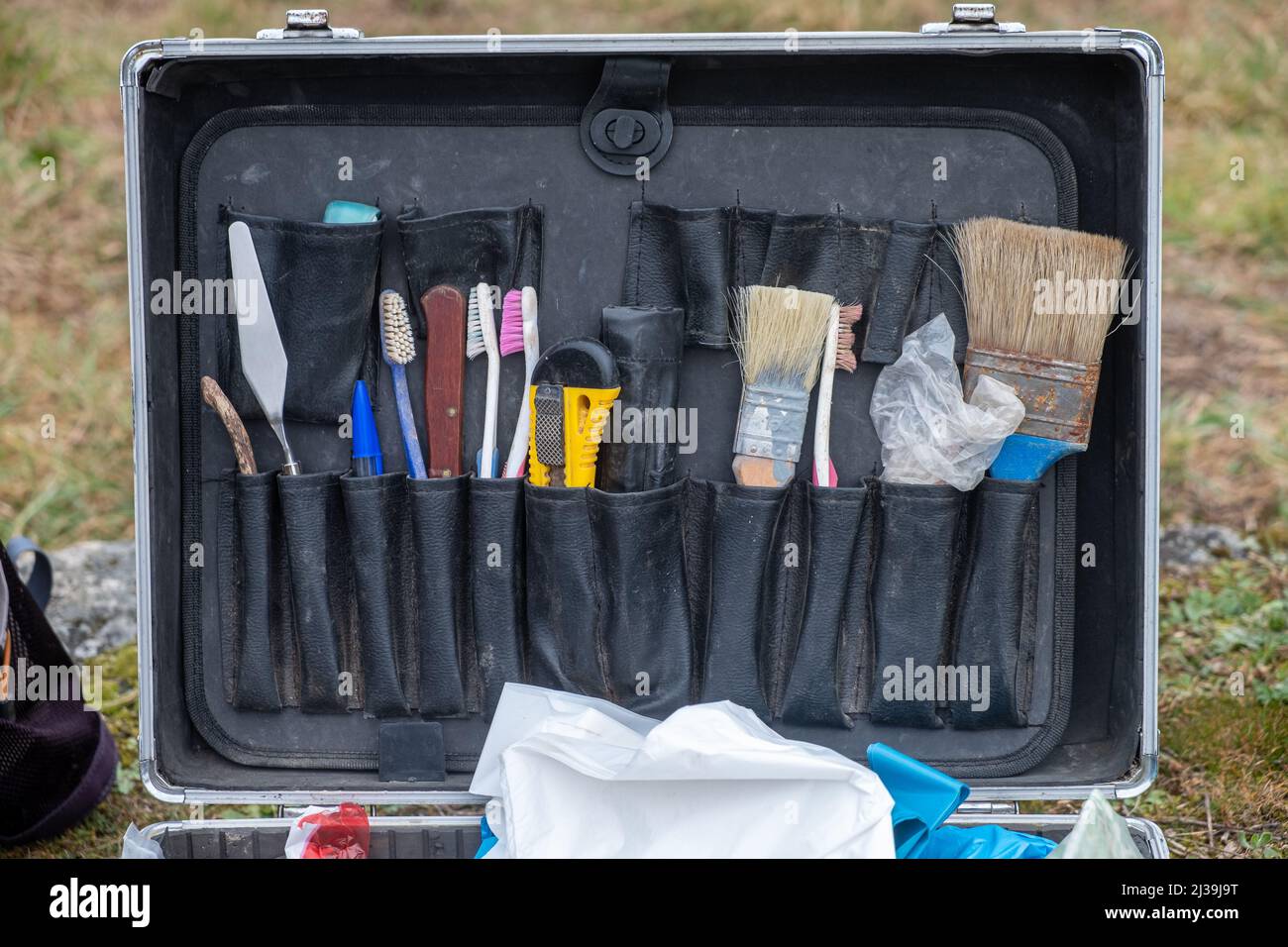 briefcase with small tools in an archaeological excavation Archaeology works Stock Photo