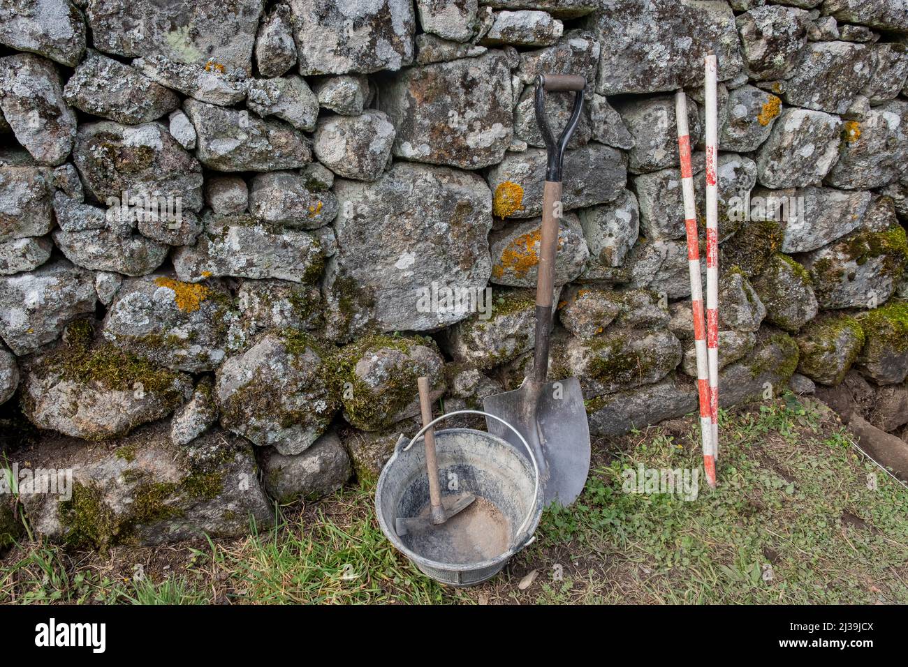 tools leaning against a wall in an archaeological excavation, archaeology works Stock Photo