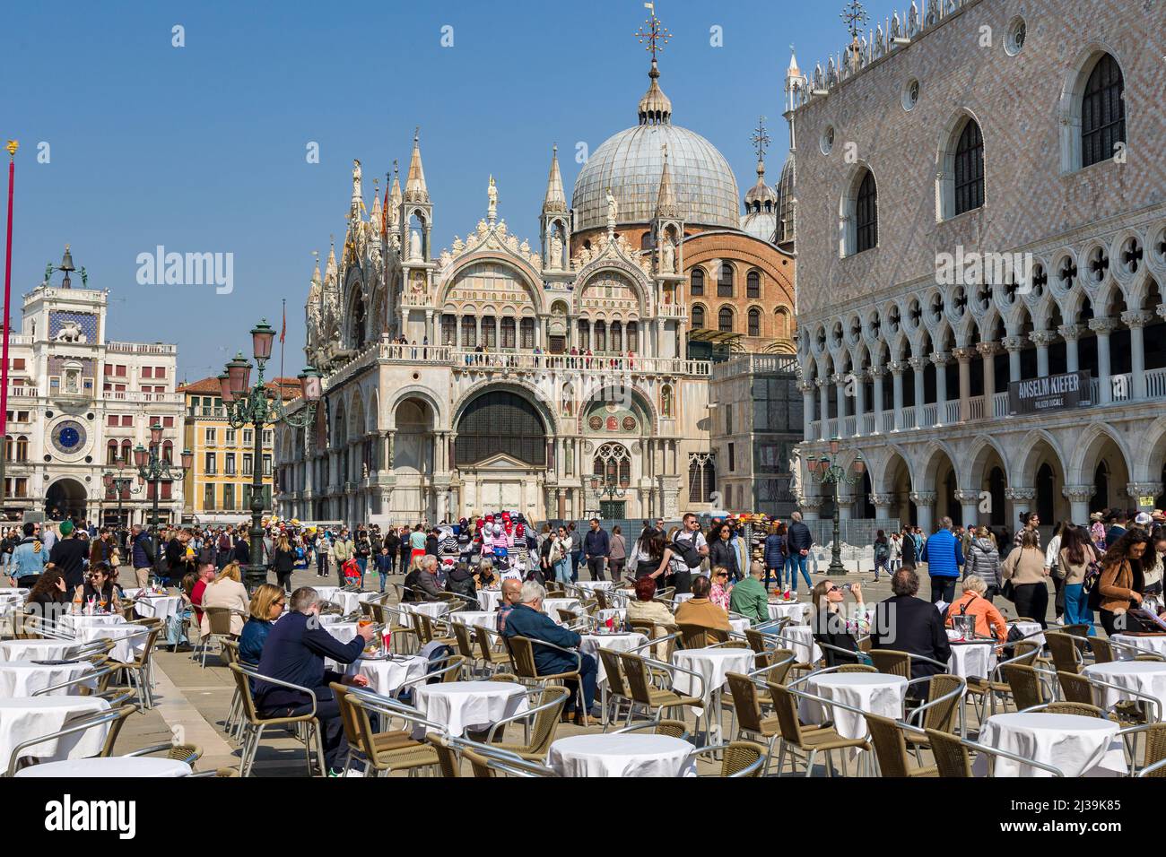 VENICE, ITALY - MARCH 27 2022: Crowds of tourists congregate around St Mark's Square and surrounding area in the famous Italian city of Venice Stock Photo