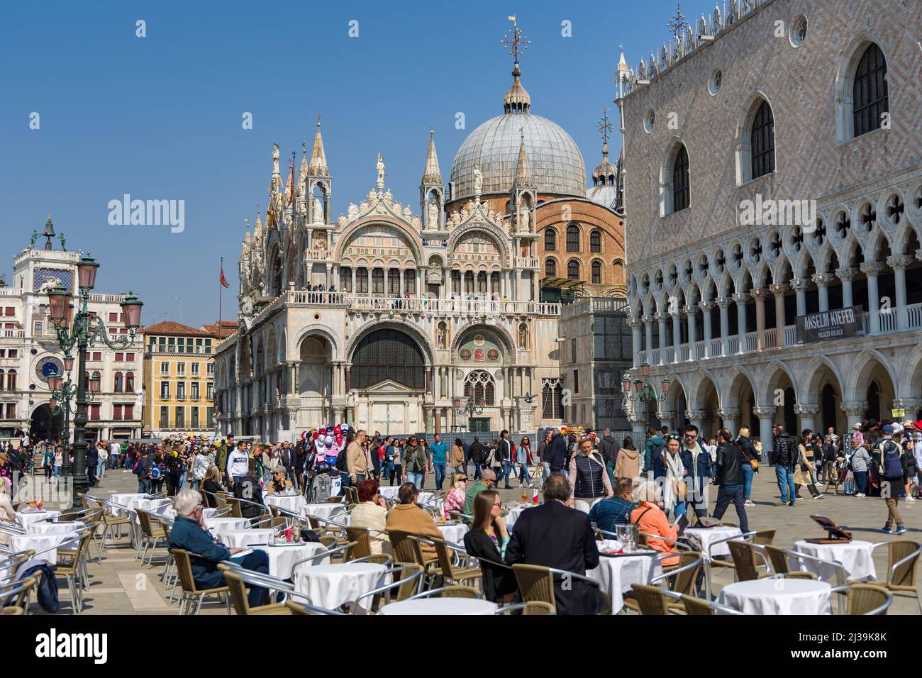 VENICE, ITALY - MARCH 27 2022: Crowds of tourists congregate around St Mark's Square and surrounding area in the famous Italian city of Venice Stock Photo