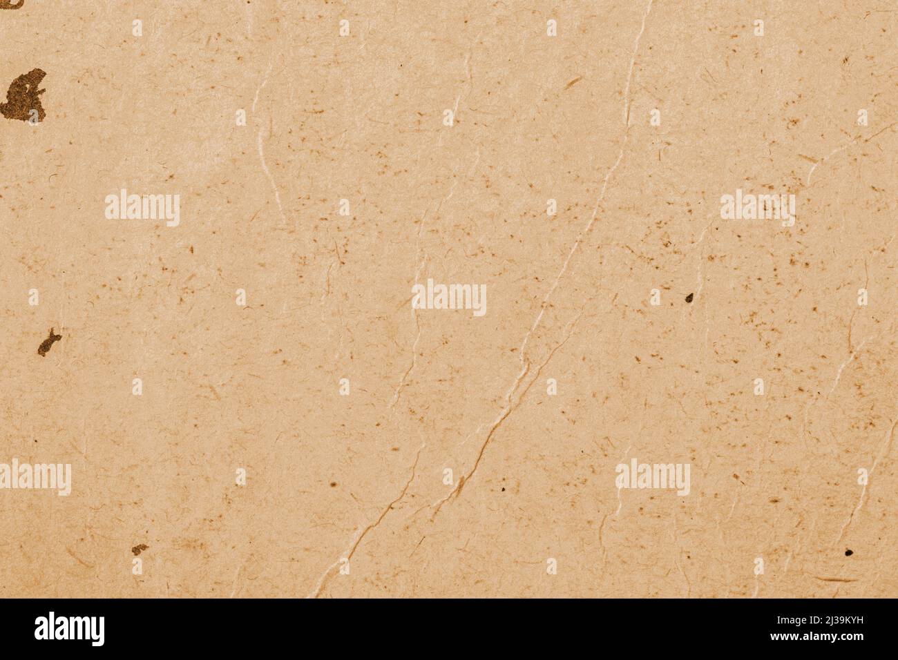Old wrinkled paper. Recyclable material, texture closeup, vintage cardboard, background Stock