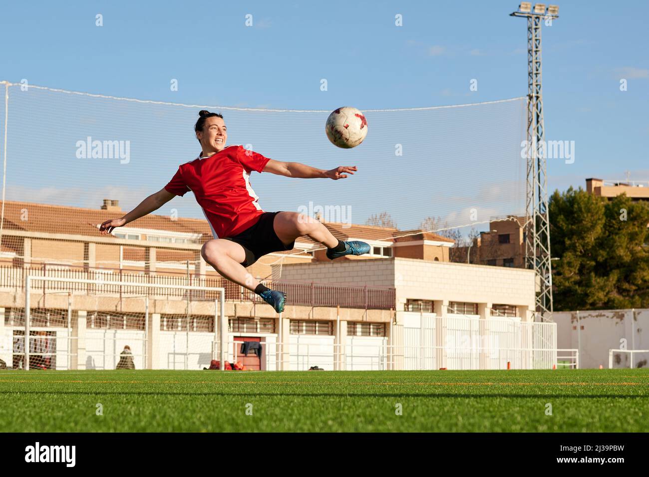 Soccer player makes an incredible shot on goal Stock Photo Alamy