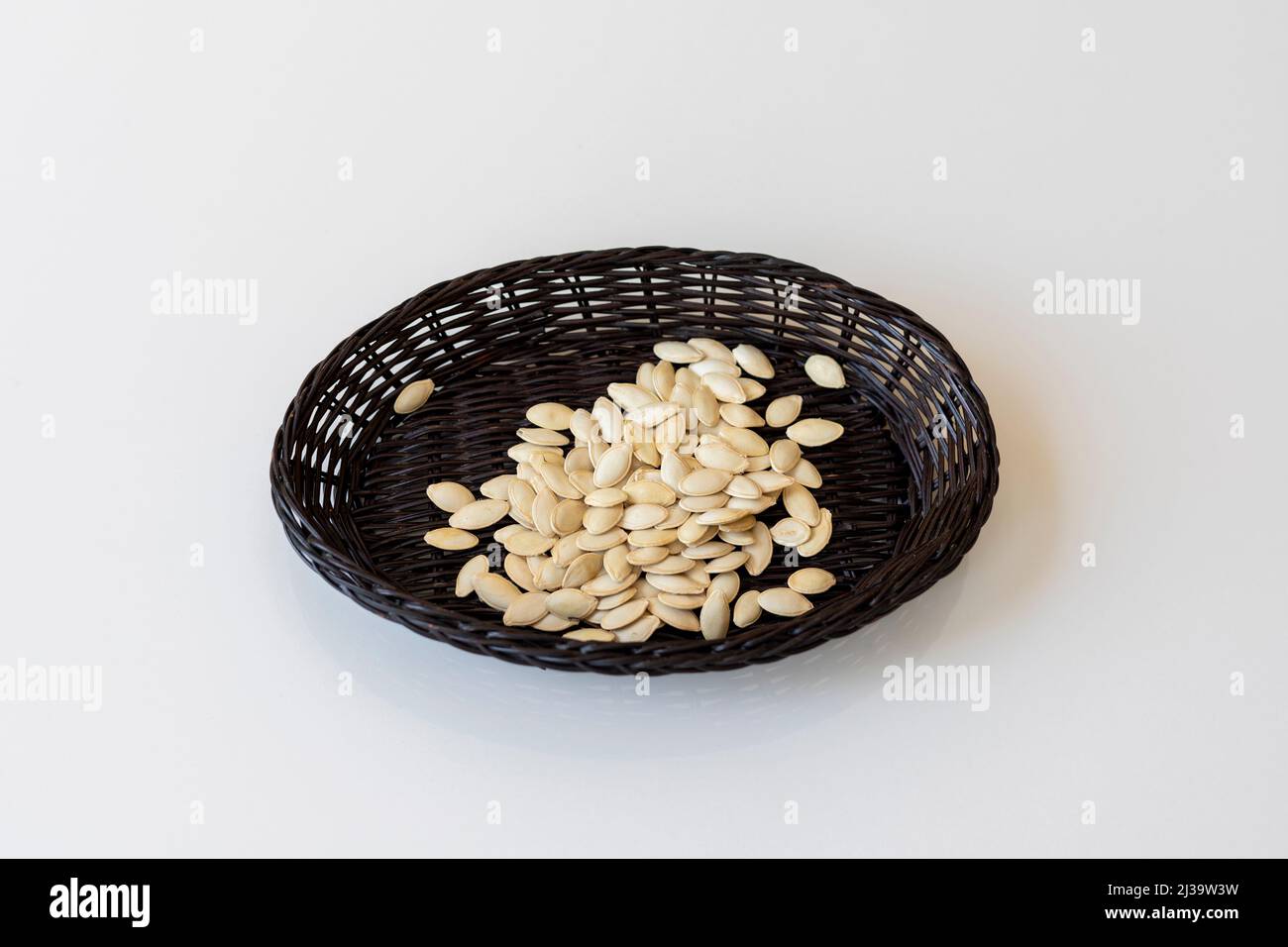 Praecitrullus or Tinda seeds in a small basket Stock Photo