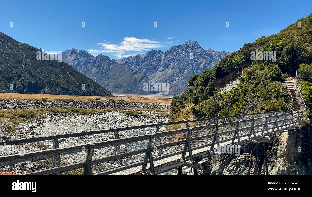 Bridge over a dry river is the start of the steep walk up thousands of steps to the Red Tarns at the peak of the mountains Stock Photo