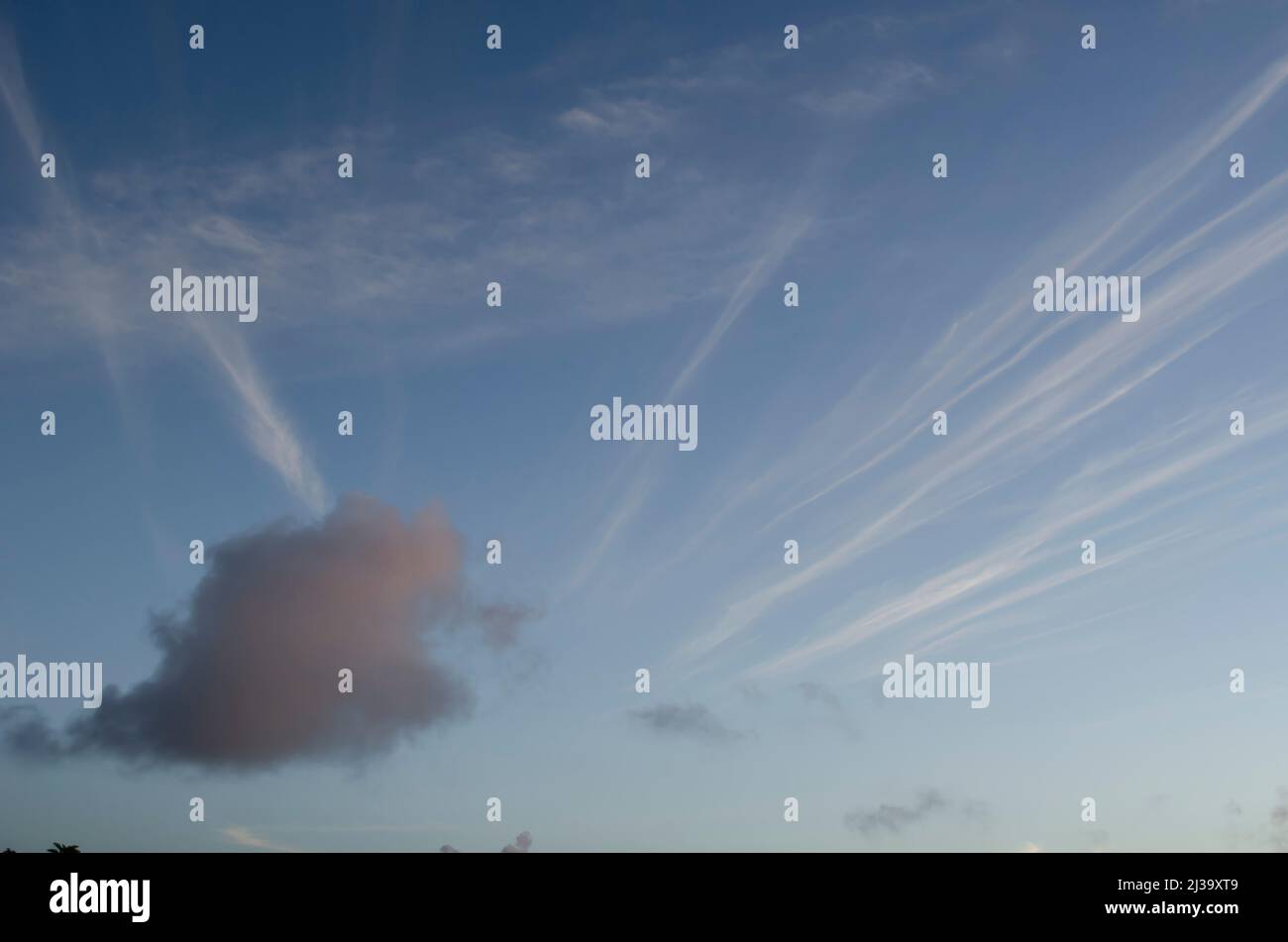 Moving Sunset Glow Cloud Across Strata Clouds Stock Photo - Alamy