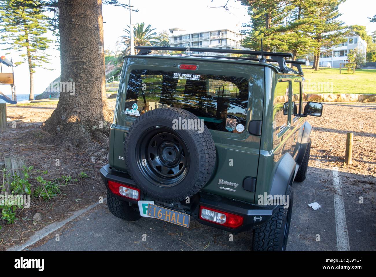 2021 Suzuki Jimny 4x4 vehicle in green parked at a beach in Sydney,NSW,Australia Stock Photo