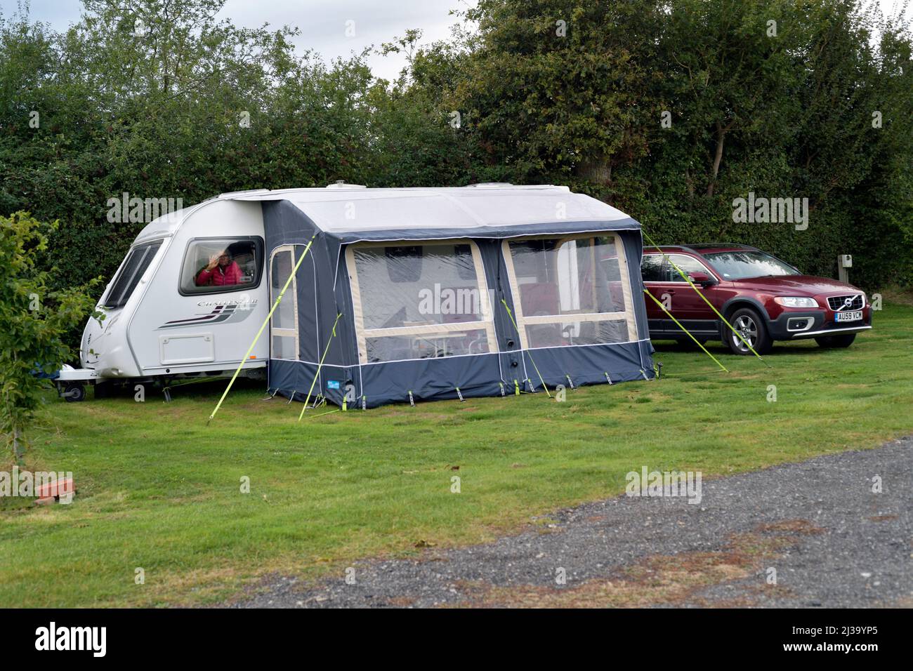 car and caravan with inflatable awning  on caravan site Stock Photo