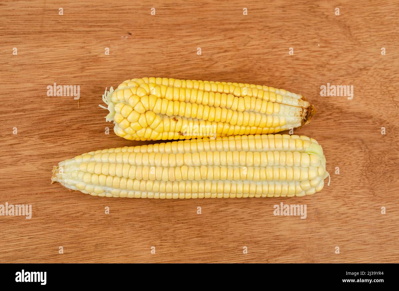 Two Corns On Board Stock Photo Alamy